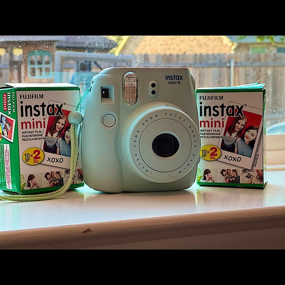 Light blue Instax mini Polaroid camera (comes with two packs of